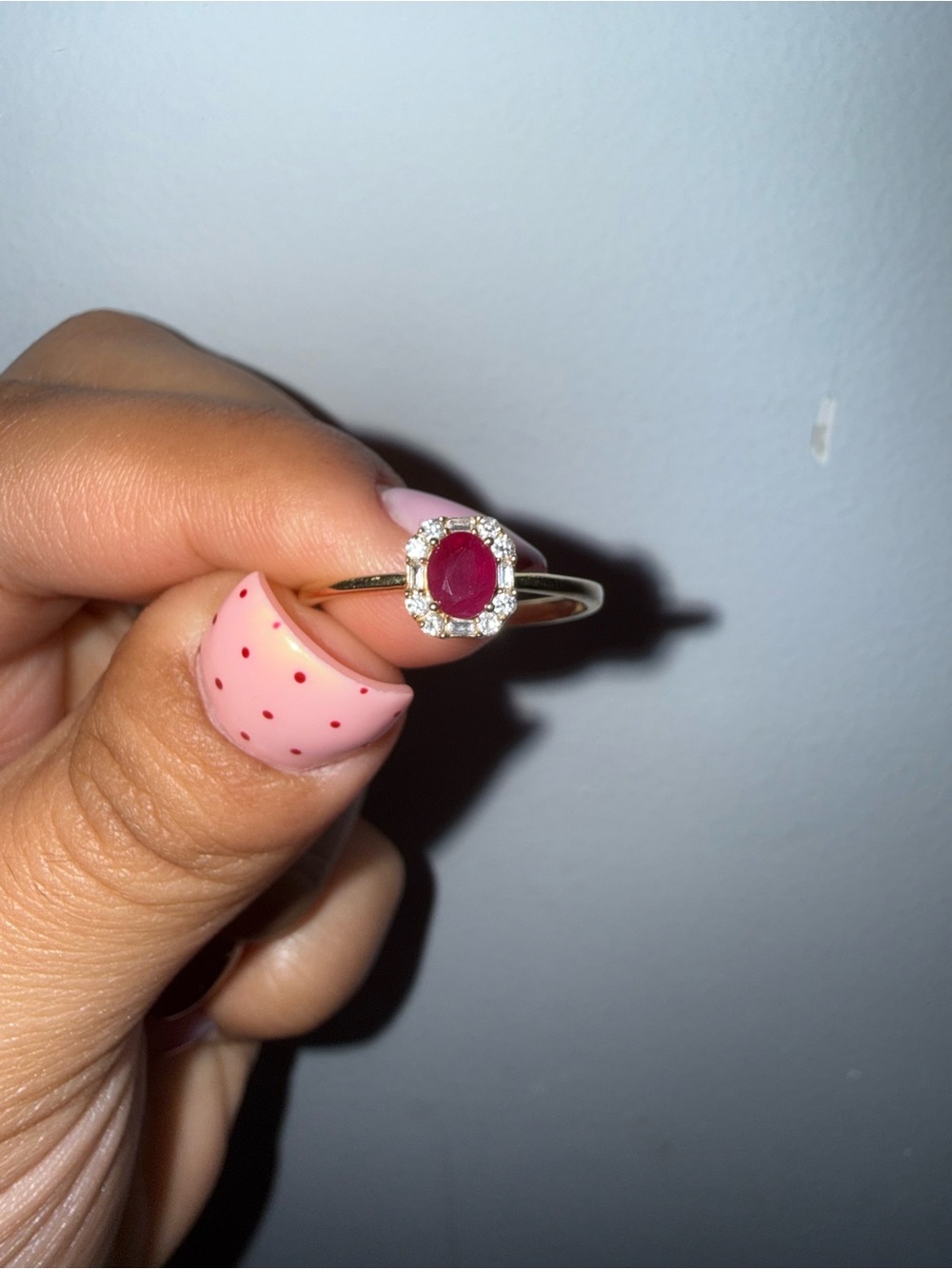 Gold Ring with Oval Ruby and Diamond Halo